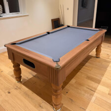 The Monaco in Walnut with grey cloth.
