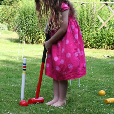 A Girl Playing Garden Games Lawn Crfoquet.