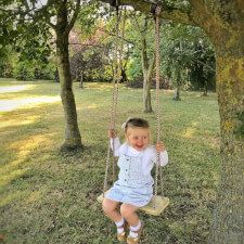Girl Swinging In The Garden Games Tree Swing.