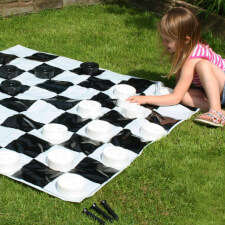 A Girl Playing Garden Games Draughts Set From Garden Games. 