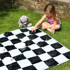 A Girl Playing Garden Games Draughts Set From Garden Games.