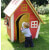 A Kid Playing In The Crooked Cottage Play House.