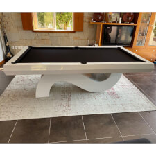 The Picasso pool table in white with black cloth.