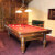 The Perigord luxury pool table, installed in a room.