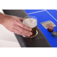 A pint glass in a glass holder.
