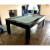 A Phoenix glossy black table with powder blue cloth