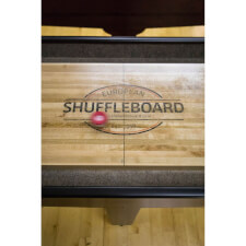 A puck moves across the Gentry shuffleboard playfield