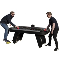 Playing a game on the portable air hockey table