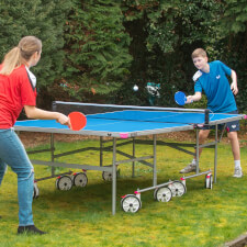People playing with Butterfly Garden Rollaway 4000 Tennis Table.