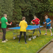People playing with Butterfly Garden Rollaway 4000 Tennis Table.
