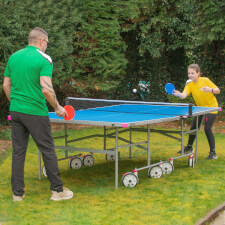 People playing with Butterfly Garden Rollaway 4000 Tennis Table.
