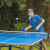 Kid playing Butterfly Garden Rollaway 5000 Tennis Table.