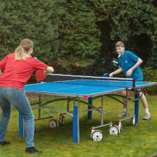 Kids playing Butterfly Garden Rollaway 5000 Tennis Table.