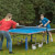 Kids playing Butterfly Garden Rollaway 5000 Tennis Table.