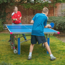 People playing in Butterfly Garden Rollaway 6000 Tennis Table.