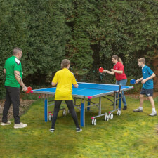 People playing in Butterfly Garden Rollaway 6000 Tennis Table.
