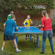 People playing in Butterfly Garden Rollaway 6000 Tennis Table.