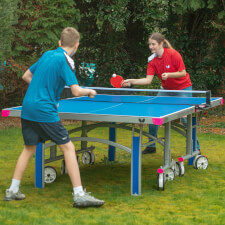 People playing Butterfly Garden Rollaway 7000 Tennis Table.