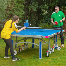 People playing Butterfly Garden Rollaway 7000 Tennis Table.