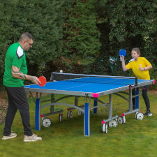 People playing Butterfly Garden Rollaway 7000 Tennis Table.