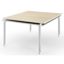 Spider tables stacked for storage.