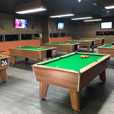 The Blackball pool tables in a room for competition.