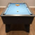 The Blackball slate bed pool table in black.