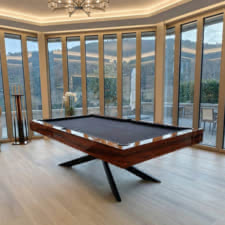 The Spider Slate Bed pool table in a room.