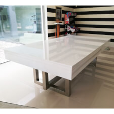 The Pixel slate bed pool table in a room in glossy white with top.