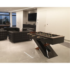 The Olympus Football table in a room.