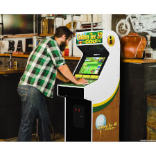 The Golden Tee arcade being played.