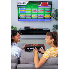 People playing Arcade1UP Atari Couchcade.