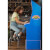 Girl playing Arcade1Up Street Fighter II Blue Machine.