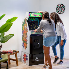People playing Arcade1up Atari legacy Centipede arcade machine.