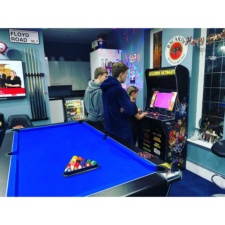 The AtGames Legends Ultimate in a games room.