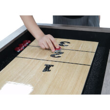 Taking a shot on the Home Shuffleboard.
