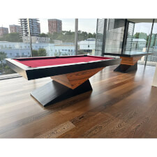 The Meridian slate bed pool table in black matte and red cloth.