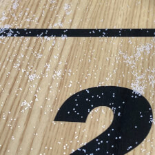 The powder on a shuffleboard playfield.