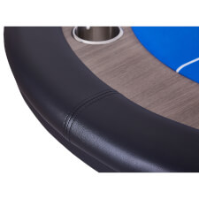 The cushioned arm rests on the High Roller poker table.