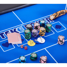 The contents of the chip set on a poker table.