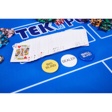 The contents of the chip set on a poker table.