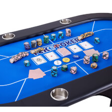 The contents of the chip set on a poker table.
