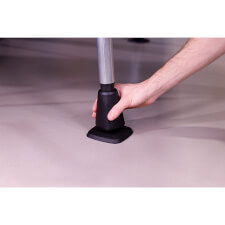 Adjusting the outer foot for level.