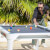 People playing Cornilleau Hyphen Outdoor pool table.