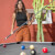 People playing Cornilleau Hyphen Outdoor pool table.