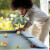 People playing Cornilleau Hyphen Outdoor pool table.