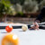 People playing Cornilleau Hyphen Outdoor pool table.