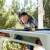 People playing Cornilleau Hyphen Outdoor pool table.