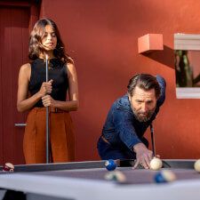 People playing Cornilleau Hyphen Outdoor pool table.