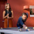 People playing Cornilleau Hyphen Outdoor pool table.